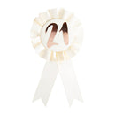 Insigne d'anniversaire en or rose sur rosette blanche