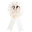 Insigne d'anniversaire en or rose sur rosette blanche